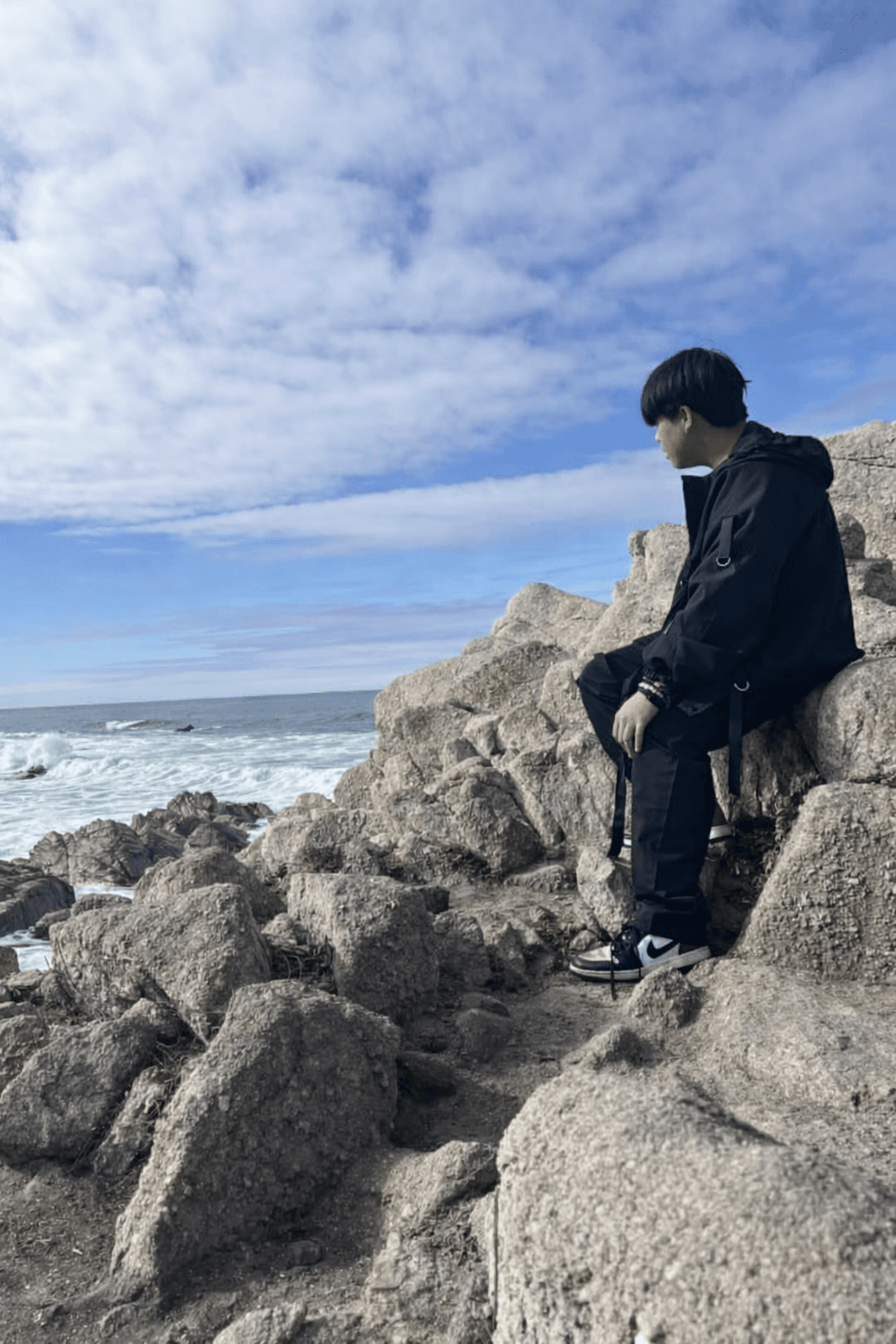 Ken, founder of NorthCore Computing Solutions, seated by the coast