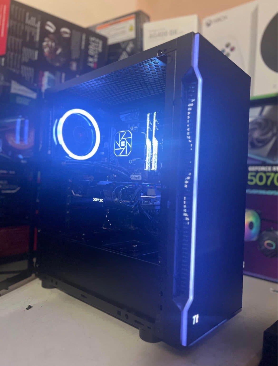 Reassembled desktop PC running with blue lighting after repair