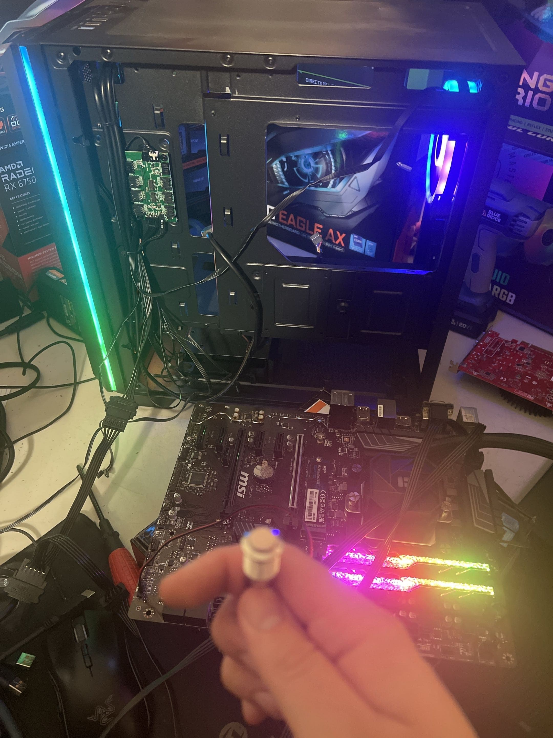 Open desktop PC with a graphics card removed during diagnosis