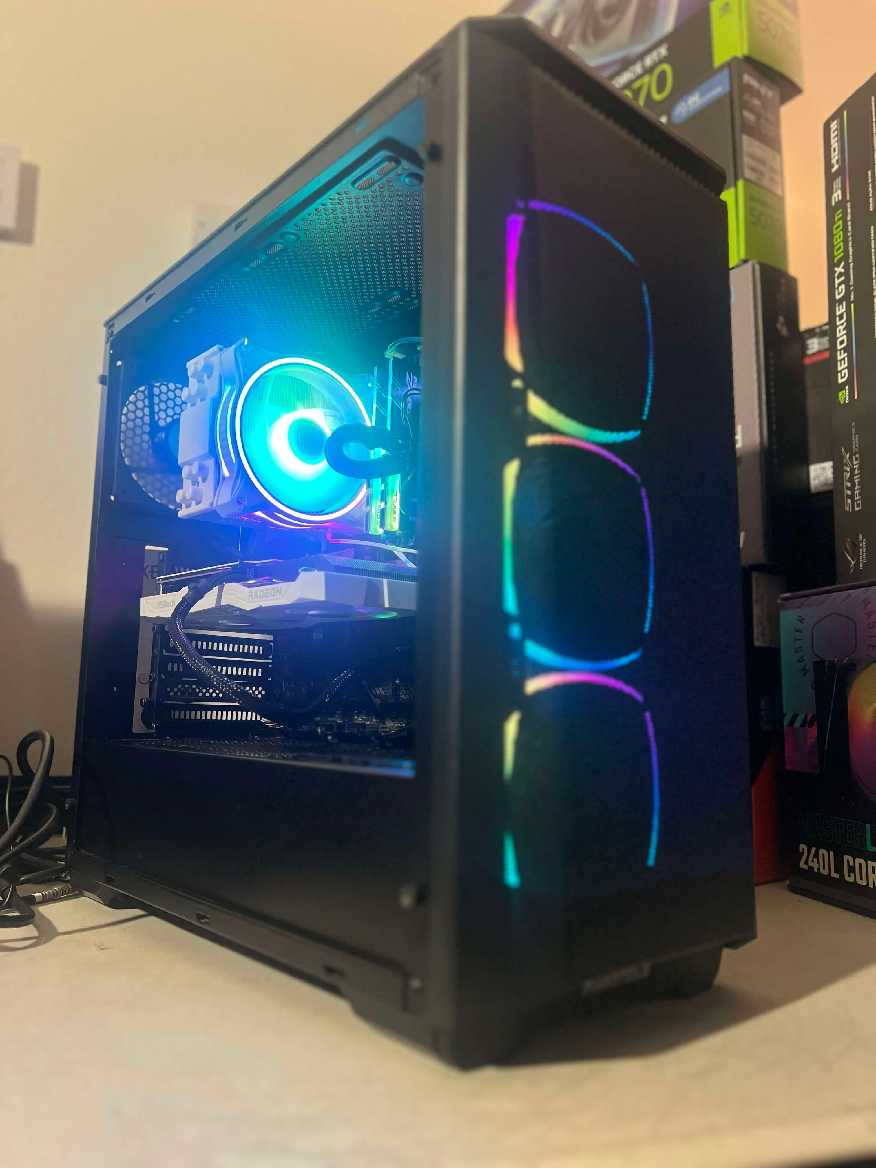 Black desktop PC with RGB ring fans and illuminated memory